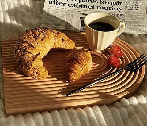 The tray's oval design is visually soothing and functional, cradling my morning essentials in its gentle grooves. 